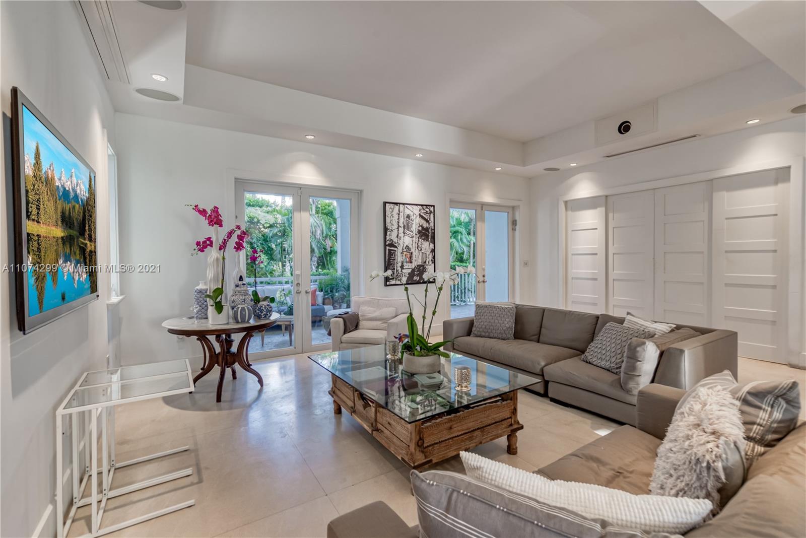 325 Hampton Lane Key Biscayne, FL 33149 - Photo 9 of 37 a living room with furniture and a flat screen tv