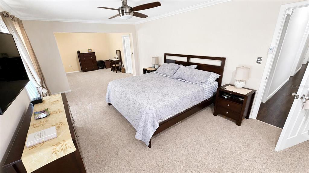 2313 Southeast 7th Street Ocala, FL 34471 - Photo 36 of 54 a bed sitting in a bedroom with a tv