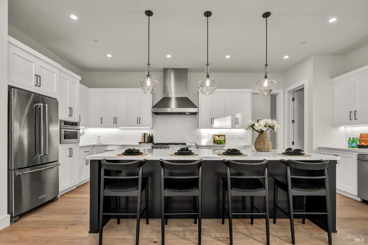2011 Long Leaf Court Santa Rosa, CA 95403 - Photo 11 of 55 a kitchen with stainless steel appliances kitchen island granite countertop a table chairs stove and cabinets