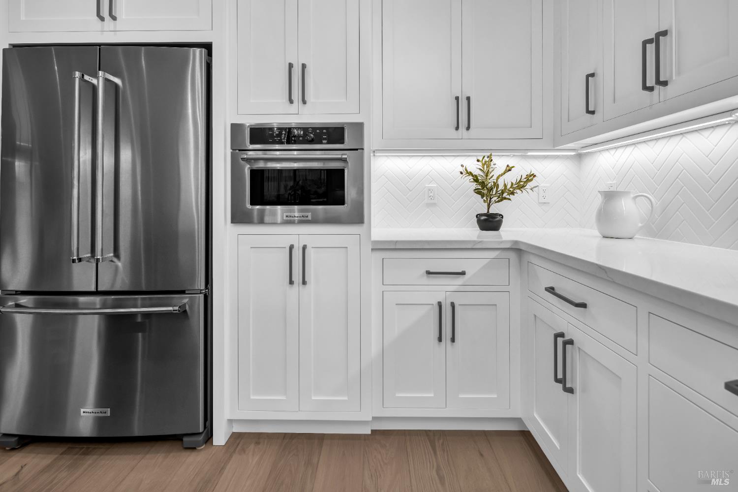 2011 Long Leaf Court Santa Rosa, CA 95403 - Photo 18 of 55 a kitchen with white cabinets and stainless steel appliances