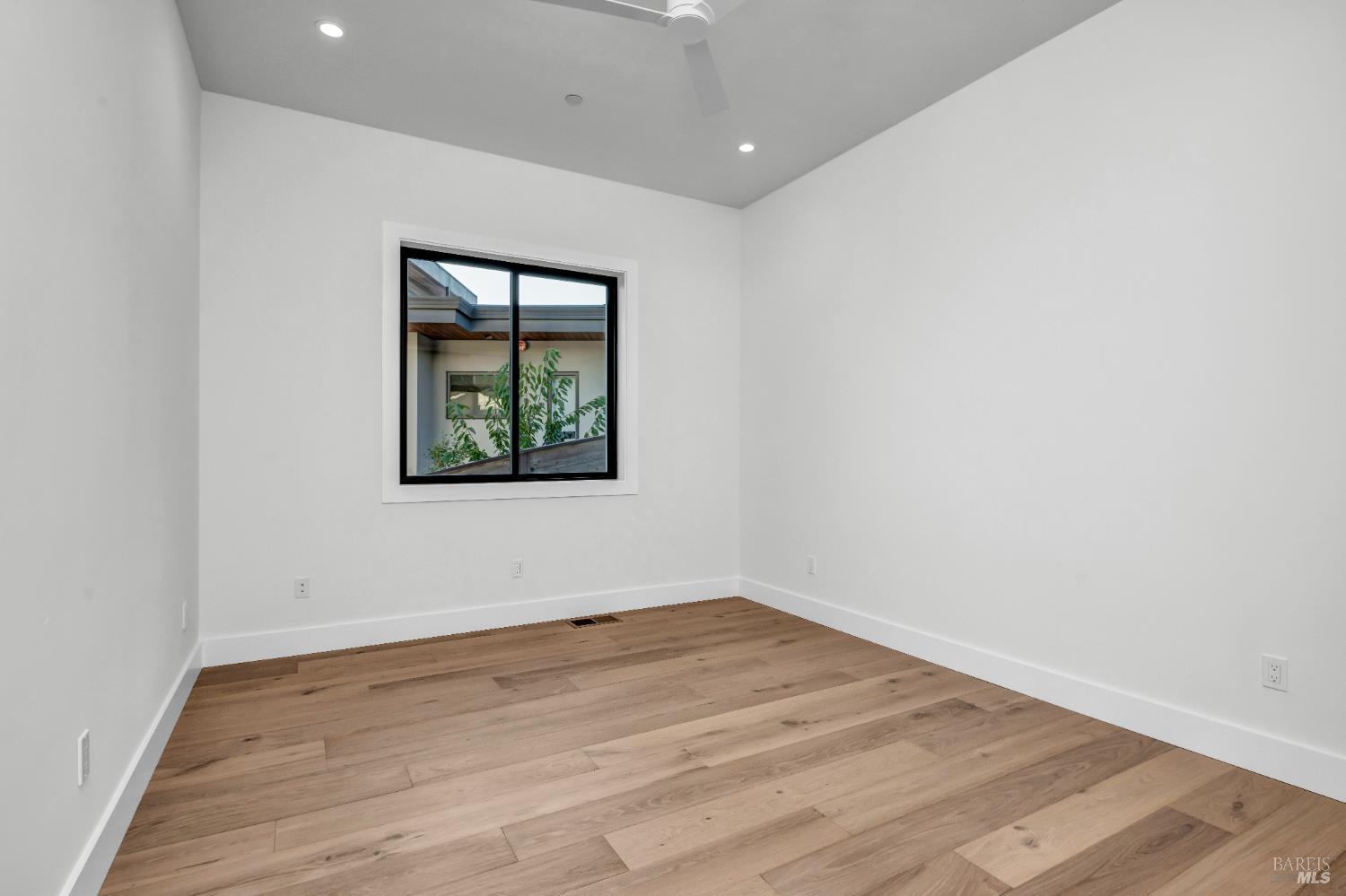 2011 Long Leaf Court Santa Rosa, CA 95403 - Photo 40 of 55 a view of empty room with wooden floor and fan
