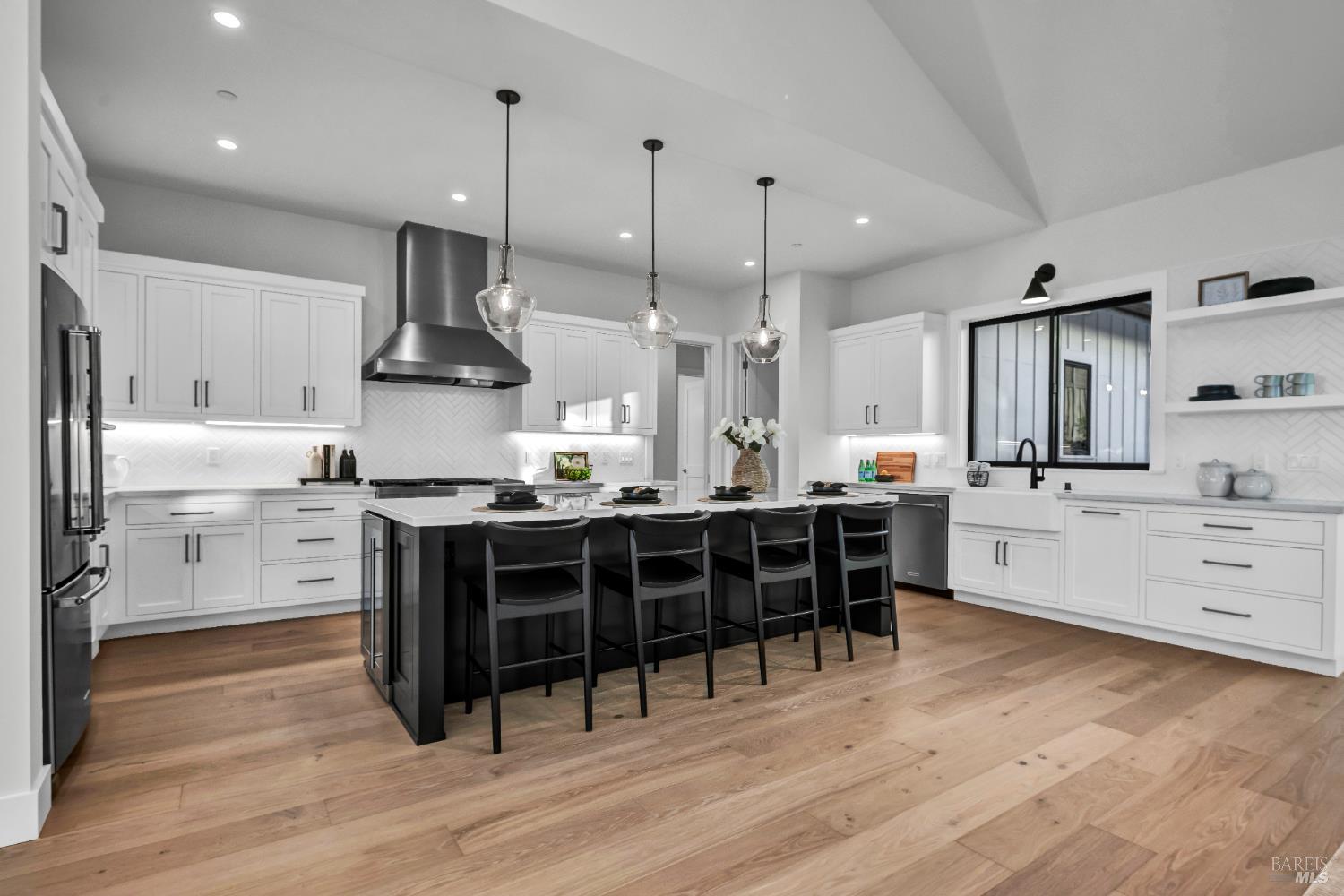 2011 Long Leaf Court Santa Rosa, CA 95403 - Photo 10 of 55 a kitchen with stainless steel appliances kitchen island wooden floors stove and white cabinets