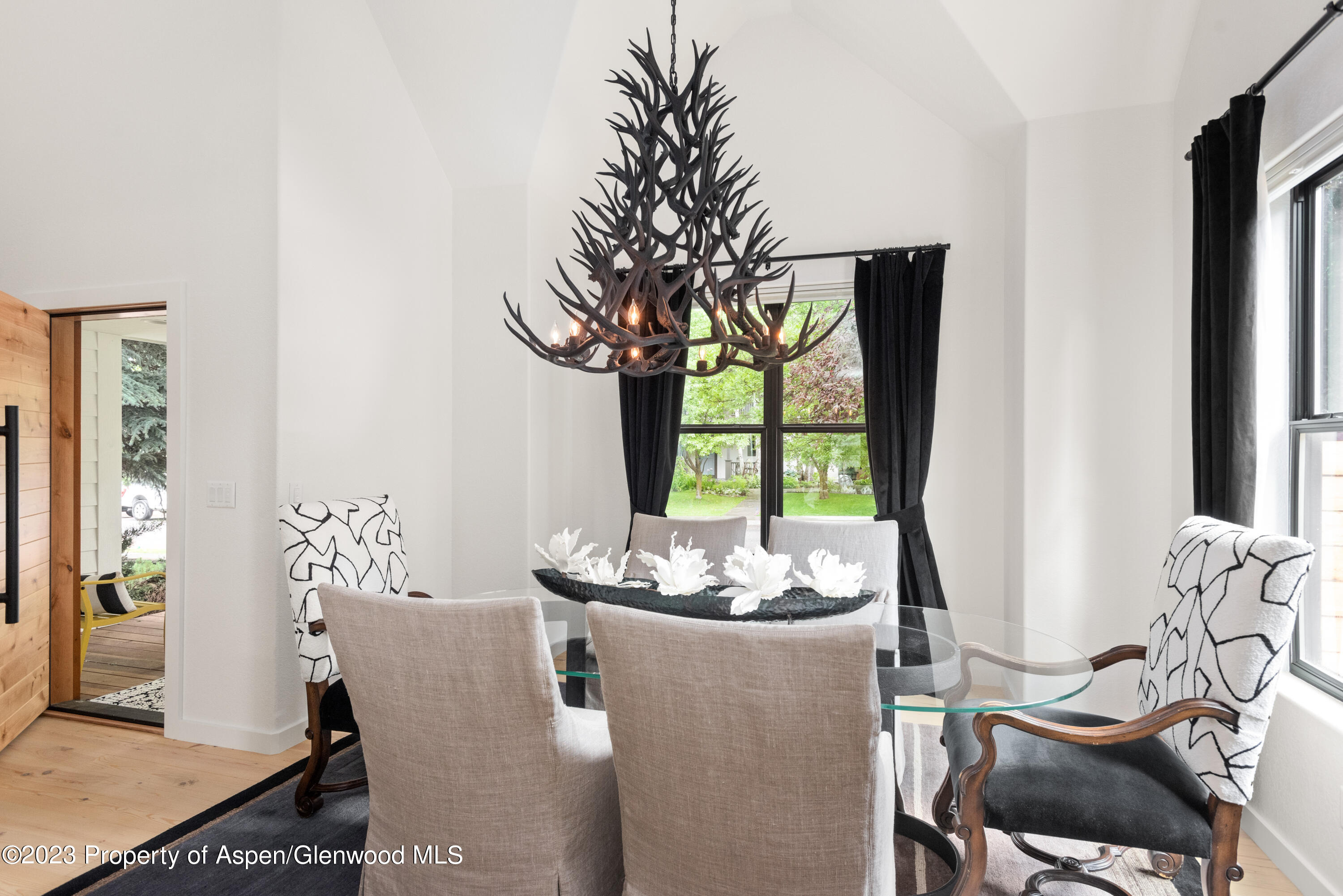 324 Summerset Lane Basalt, CO 81621 - Photo 11 of 40 a dining room with furniture and window