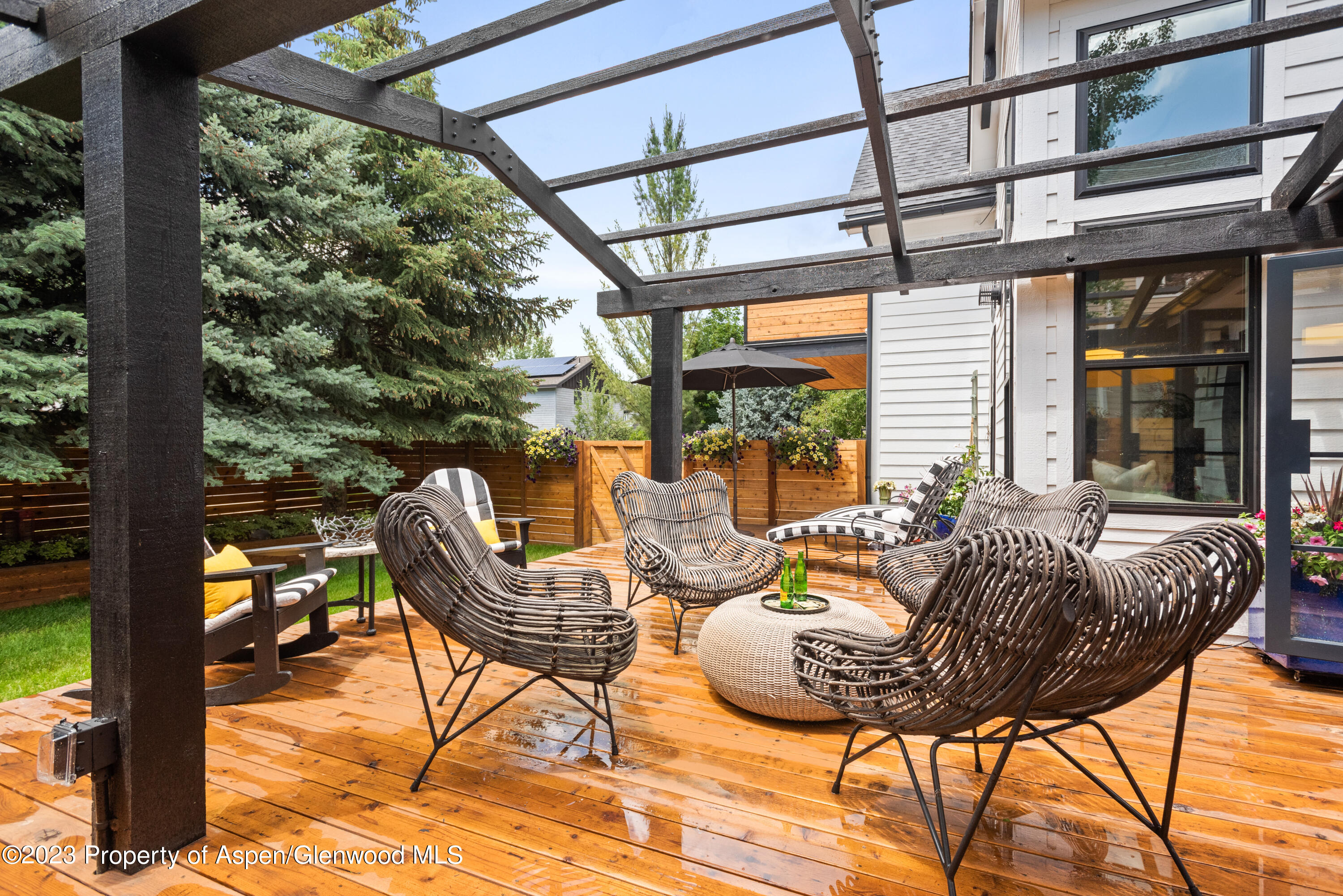 324 Summerset Lane Basalt, CO 81621 - Photo 18 of 40 a outdoor space with the couches and dining table with the garden view