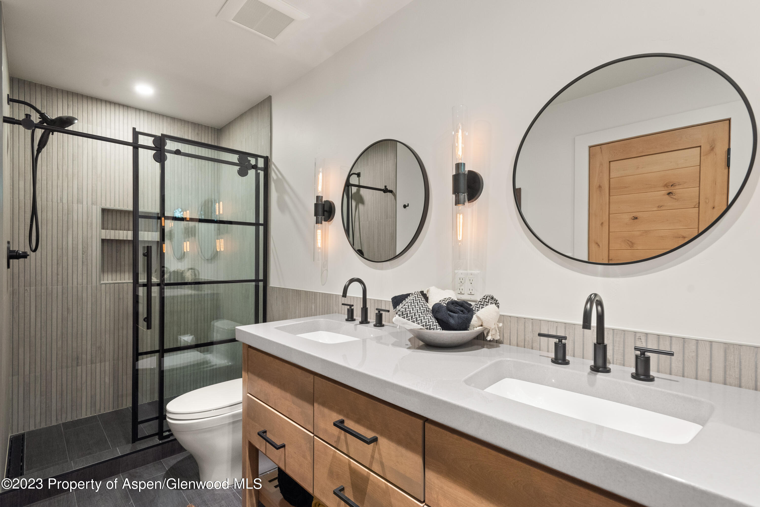 324 Summerset Lane Basalt, CO 81621 - Photo 24 of 40 a bathroom with a toilet a sink and a mirror