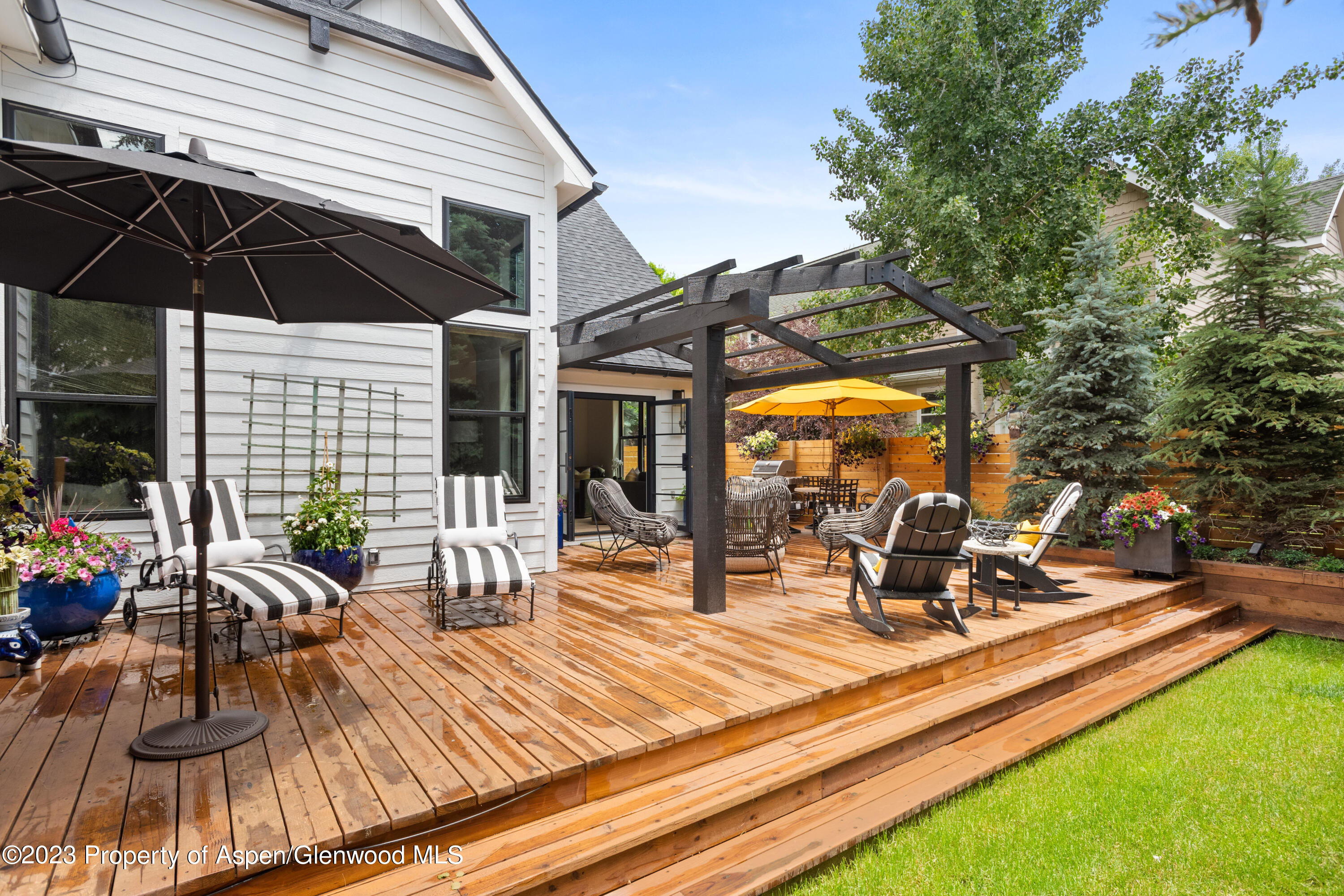 324 Summerset Lane Basalt, CO 81621 - Photo 35 of 40 a view of a patio with table and chairs under an umbrella