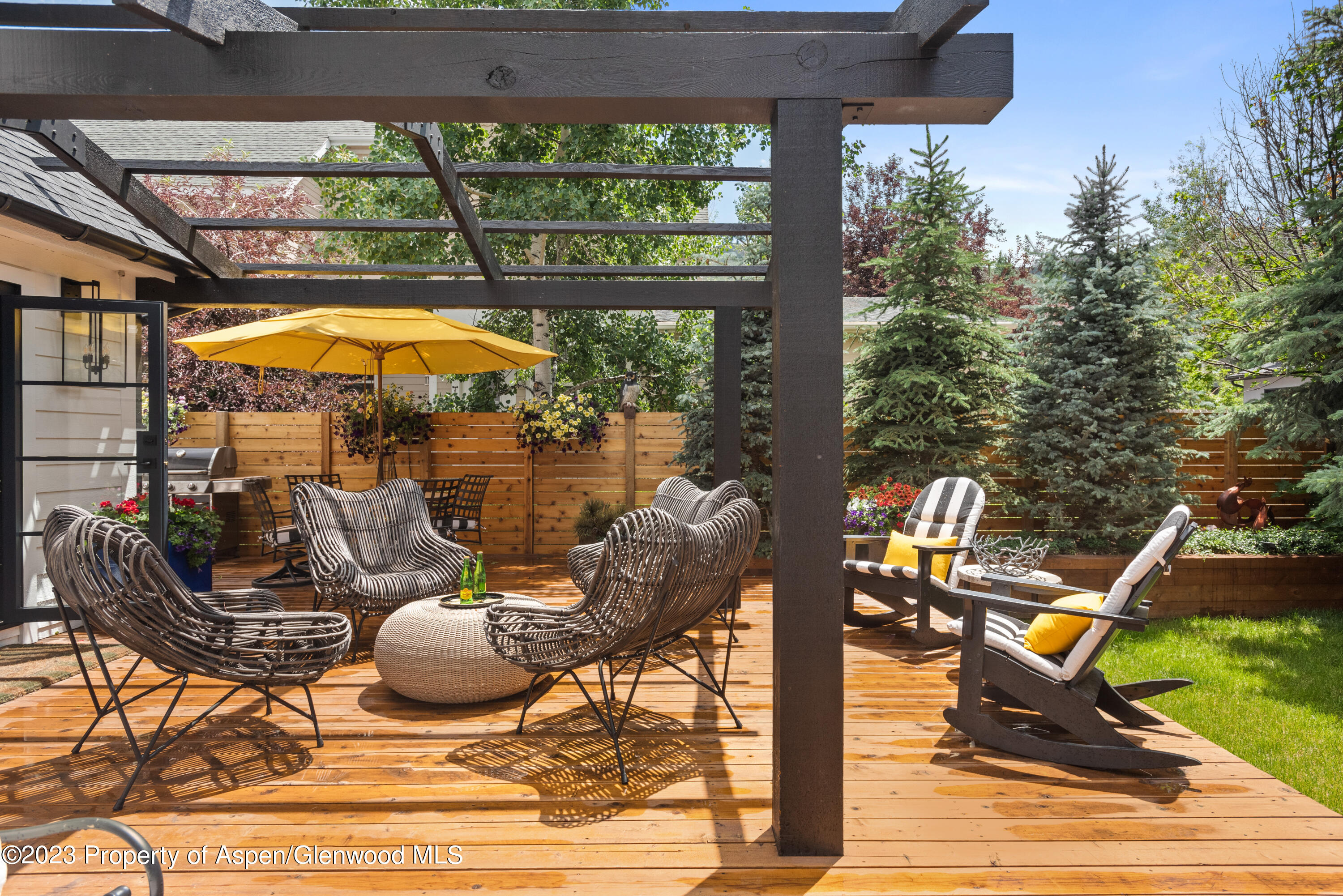 324 Summerset Lane Basalt, CO 81621 - Photo 37 of 40 a outdoor space with the couches and dining table with the garden view