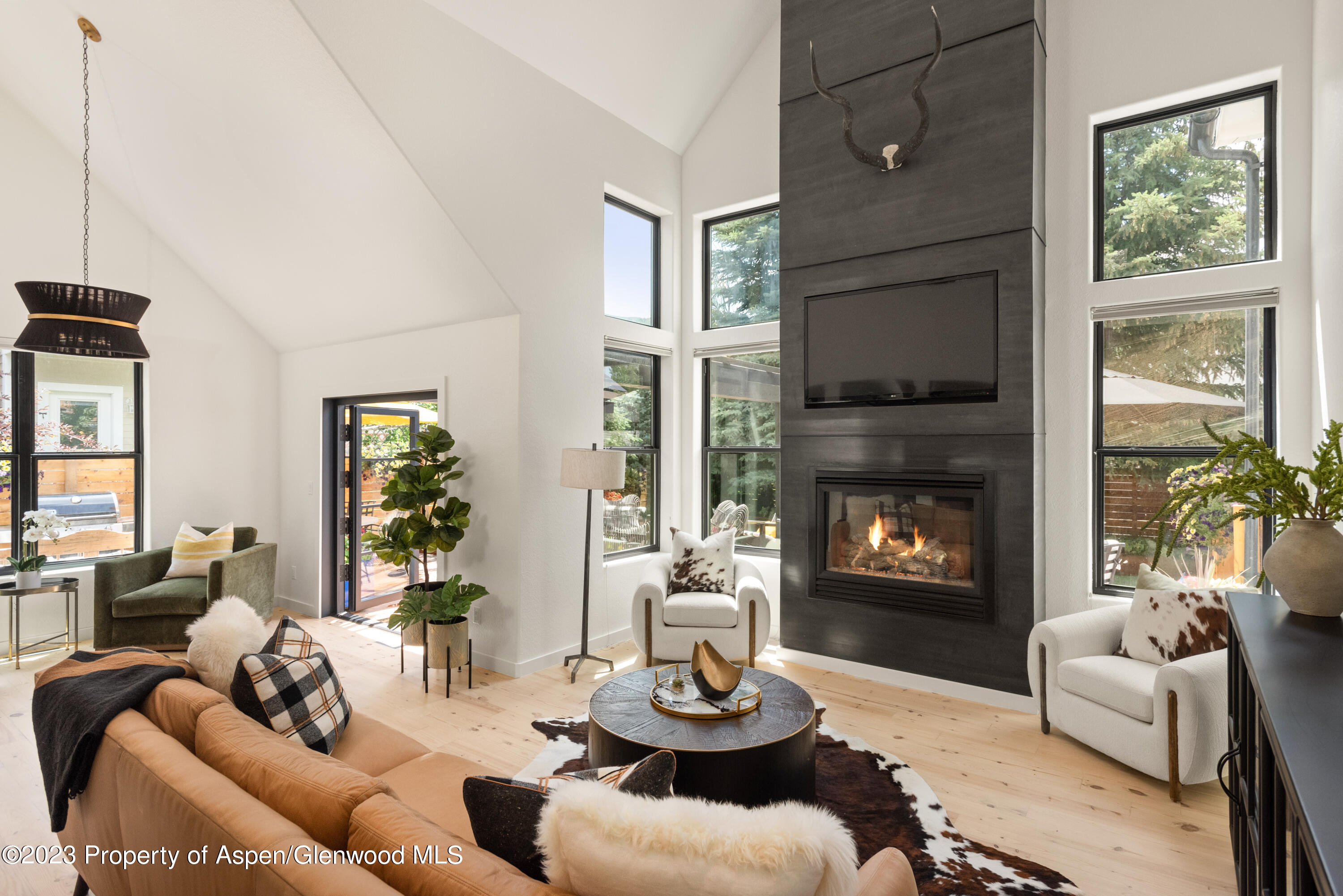 324 Summerset Lane Basalt, CO 81621 - Photo 6 of 40 a living room with furniture a window and a fireplace