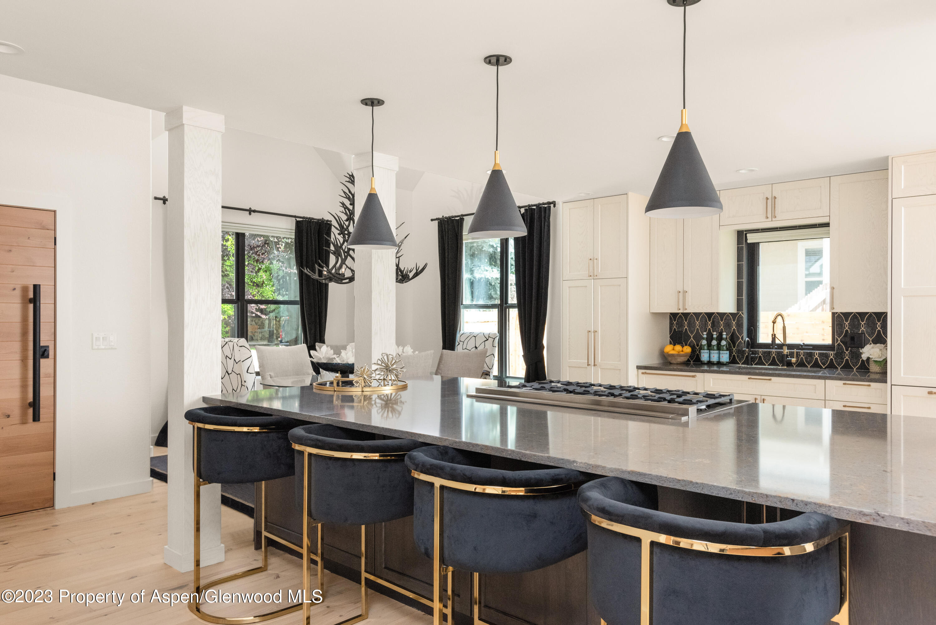 324 Summerset Lane Basalt, CO 81621 - Photo 8 of 40 a kitchen with stainless steel appliances granite countertop a stove a sink and white cabinets