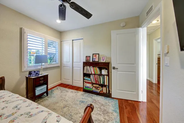 a bedroom with furniture and a book shelf
