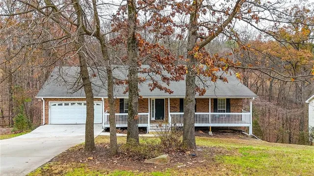 a view of a house with backyard porch and sitting area