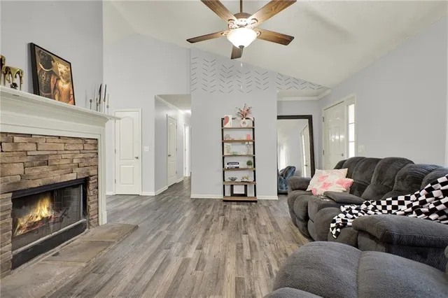 a view of a kitchen with furniture wooden floor and a window