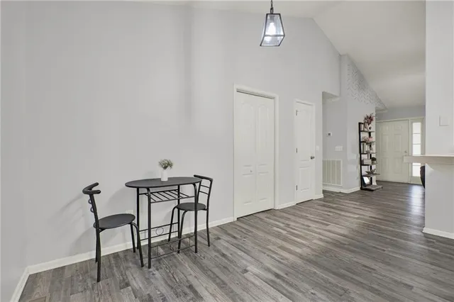 a kitchen with stainless steel appliances a refrigerator and a stove top oven