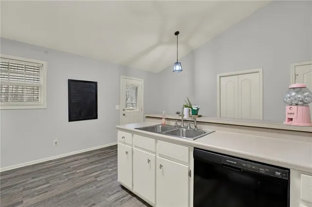 a view of a hallway with washer and dryer