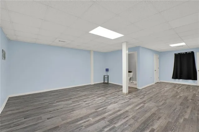 a bathroom with a sink vanity mirror and toilet