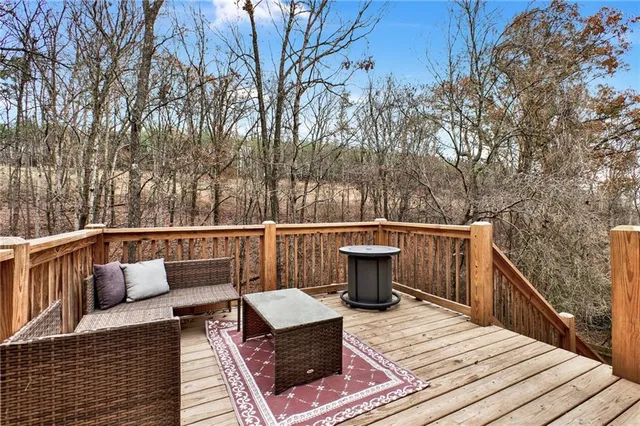 a view of a deck with a table and chairs