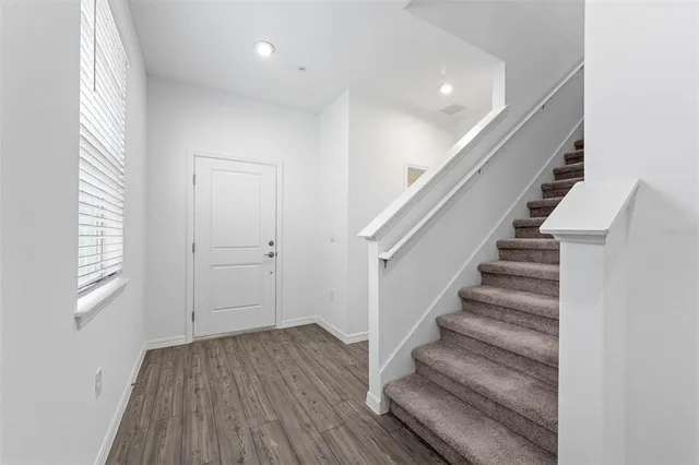 a view of entryway with wooden floor