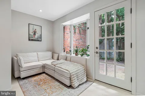 a living room with furniture and a table