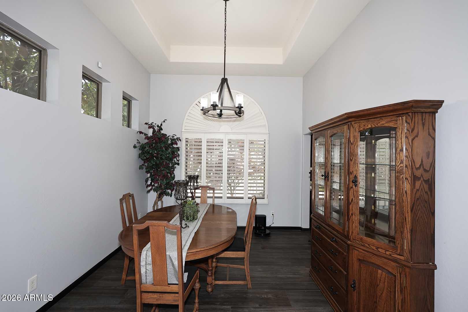 7272 West Crystal Road Glendale, AZ 85308 - Photo 8 of 52 a dining room with furniture window and wooden floor