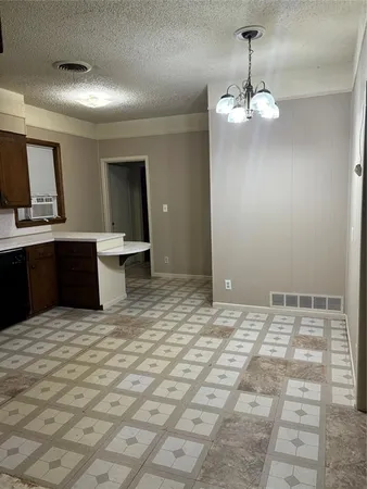 a view of a kitchen with a sink