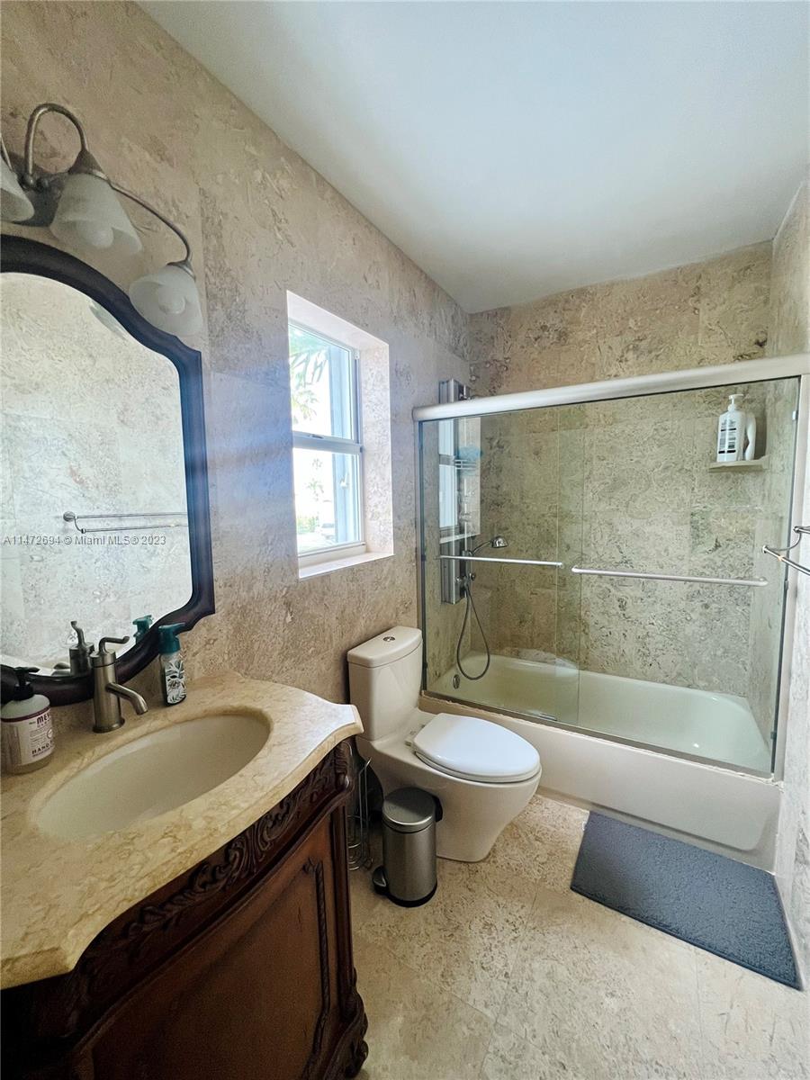 West End Miami, FL 33185 - Photo 12 of 30 a bathroom with a sink a toilet and shower