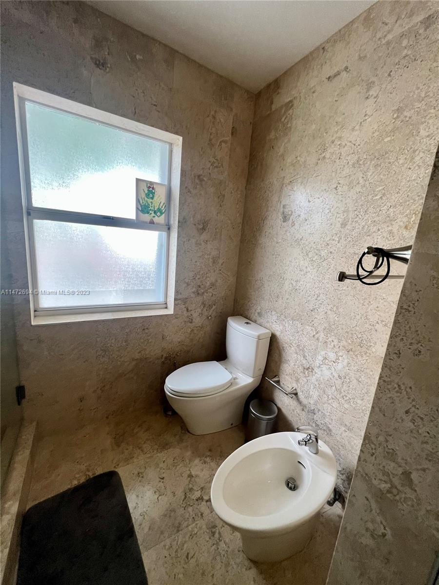 West End Miami, FL 33185 - Photo 14 of 30 a bathroom with a toilet sink and mirror