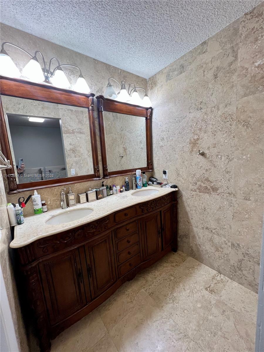 West End Miami, FL 33185 - Photo 16 of 30 a bathroom with a double vanity sink mirror and double