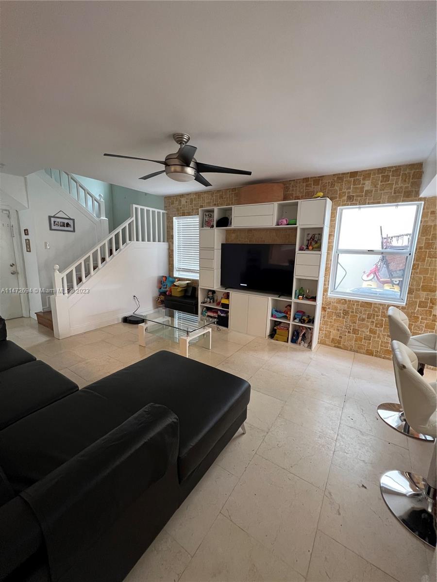 West End Miami, FL 33185 - Photo 20 of 30 a living room with furniture and flat screen tv