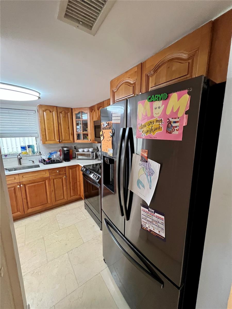 West End Miami, FL 33185 - Photo 21 of 30 a view of kitchen with furniture and refrigerator