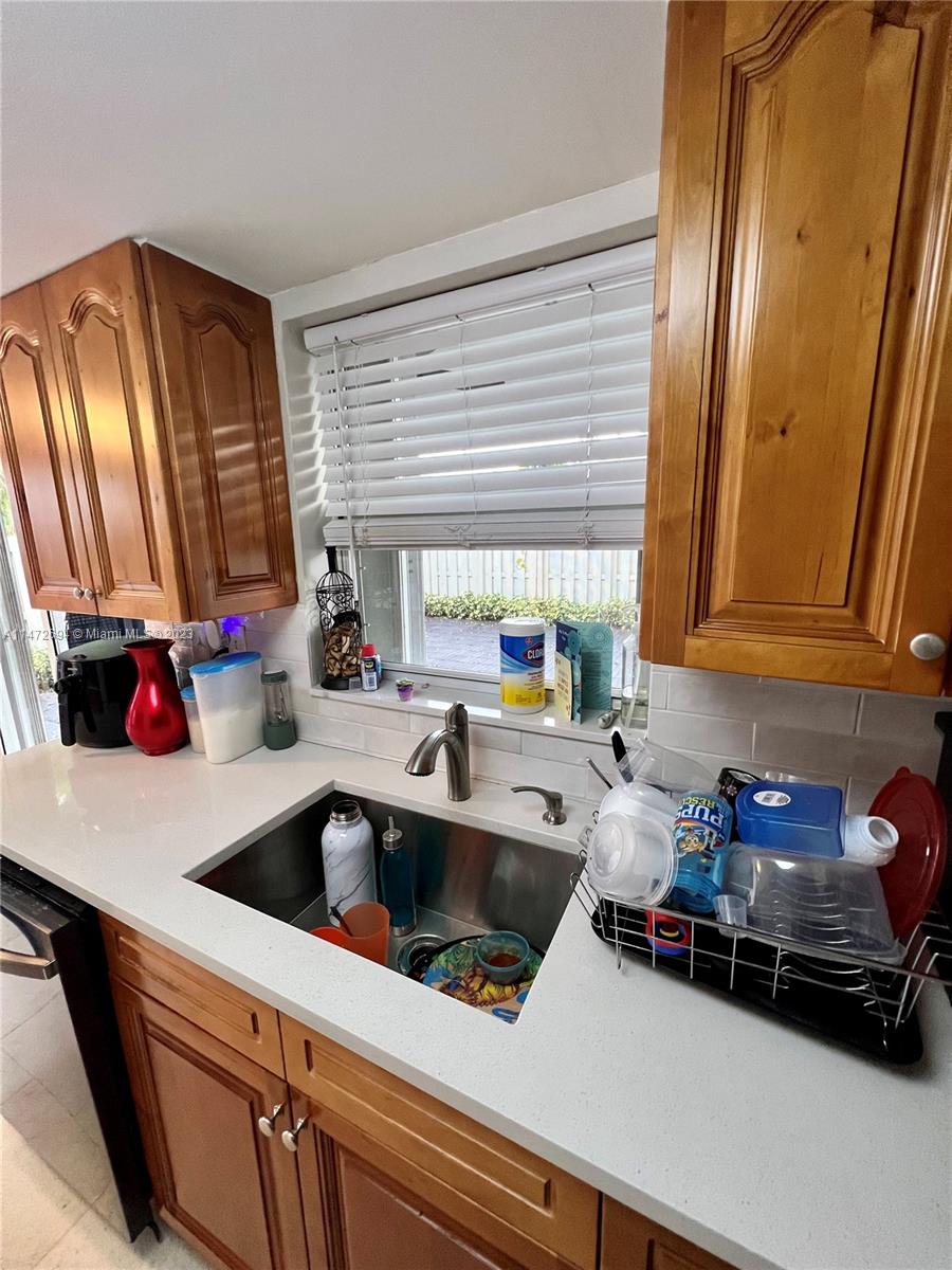 West End Miami, FL 33185 - Photo 23 of 30 a kitchen with a sink cabinets and a window