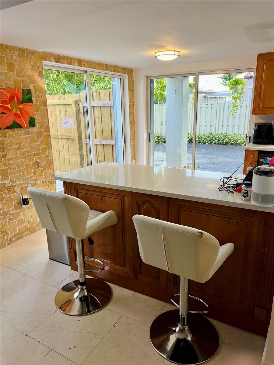 West End Miami, FL 33185 - Photo 24 of 30 a living room with furniture and a large window
