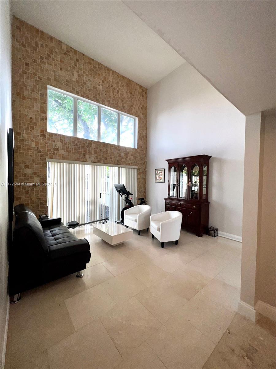 West End Miami, FL 33185 - Photo 4 of 30 a bedroom with furniture and a large window