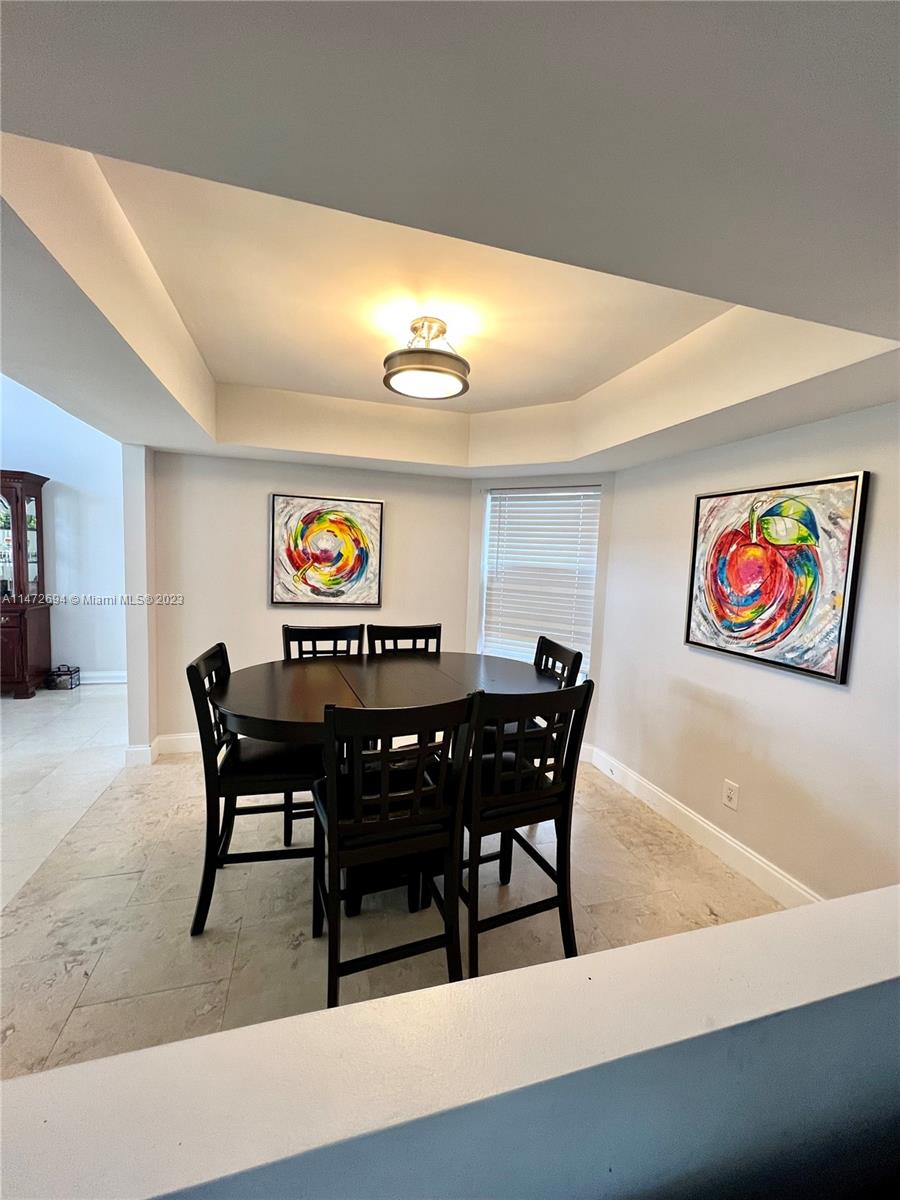 West End Miami, FL 33185 - Photo 5 of 30 a view of a dining room with furniture and wooden floor