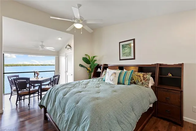 a bed sitting in a bedroom and table