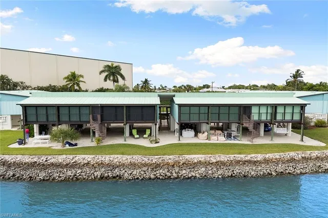 front view of a brick building with a yard