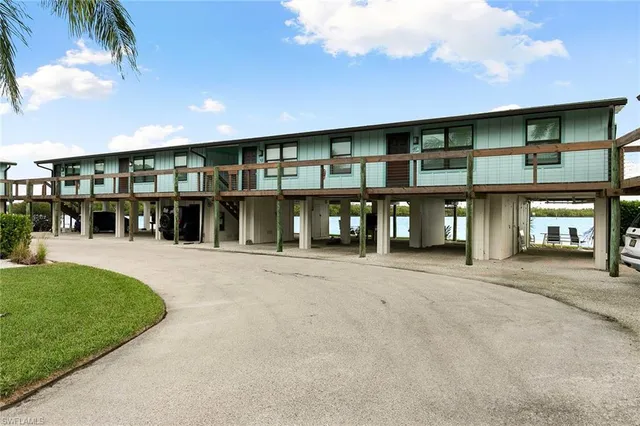 a view of a patio with couches under an umbrella