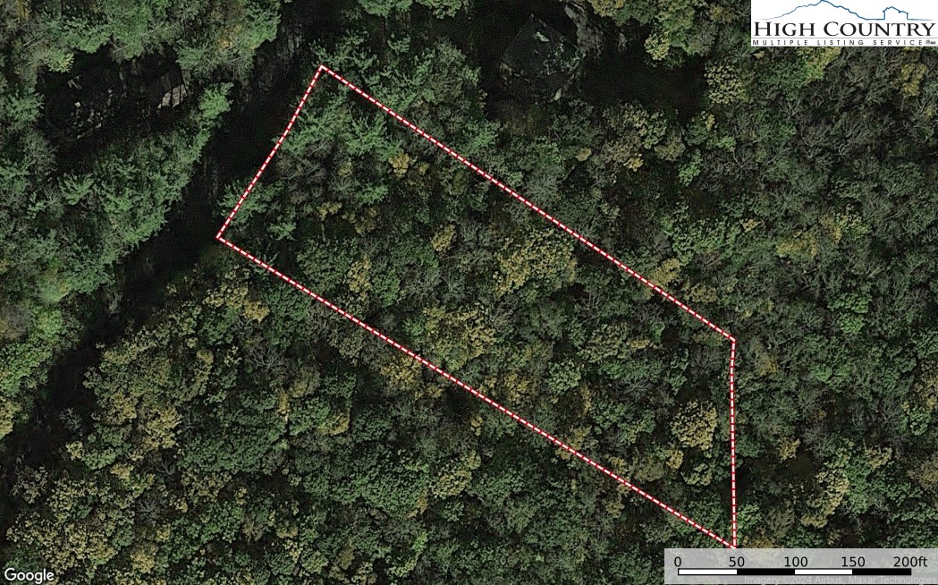 8 Woodland Ridge Lansing, NC 28643 - Photo 3 of 14 a view of a forest from a balcony