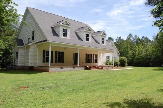 100 Lower Simmons Road Macon, GA 31220 - Photo 1 of 34 a front view of a house with a yard and trees