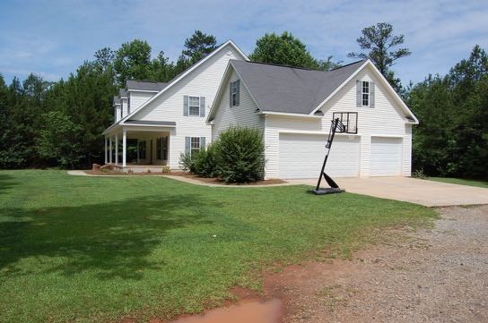 100 Lower Simmons Road Macon, GA 31220 - Photo 3 of 34 a front view of house with a garden and plants