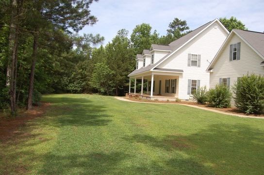 100 Lower Simmons Road Macon, GA 31220 - Photo 24 of 34 a front view of a house with a yard