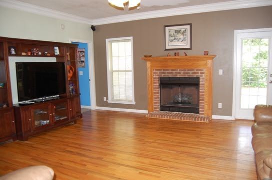 100 Lower Simmons Road Macon, GA 31220 - Photo 5 of 34 a living room with furniture and a fireplace