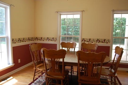 100 Lower Simmons Road Macon, GA 31220 - Photo 7 of 34 a view of a dining room with furniture window and wooden floor
