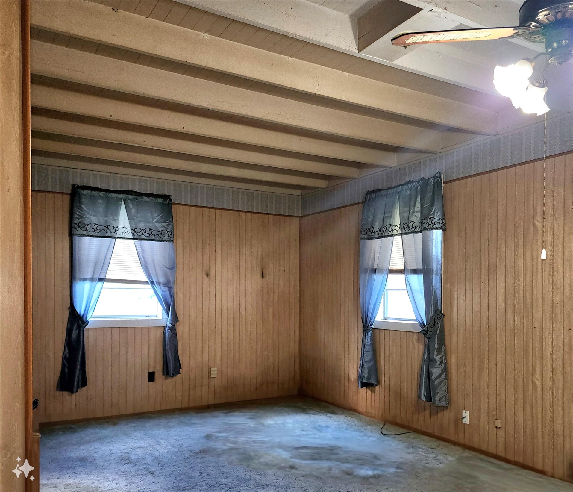 612 Black Street Schulenburg, TX 78956 - Photo 11 of 16 a view of an empty room with wooden floor and a window