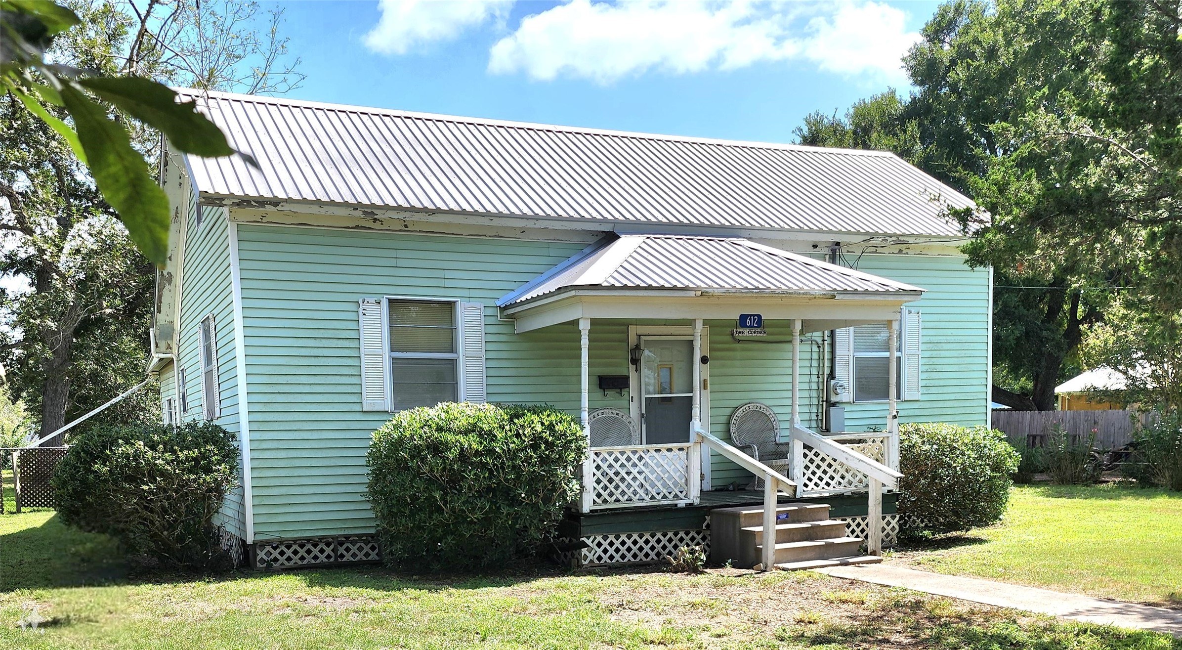 612 Black Street Schulenburg, TX 78956 - Photo 4 of 16 a front view of a house with a yard