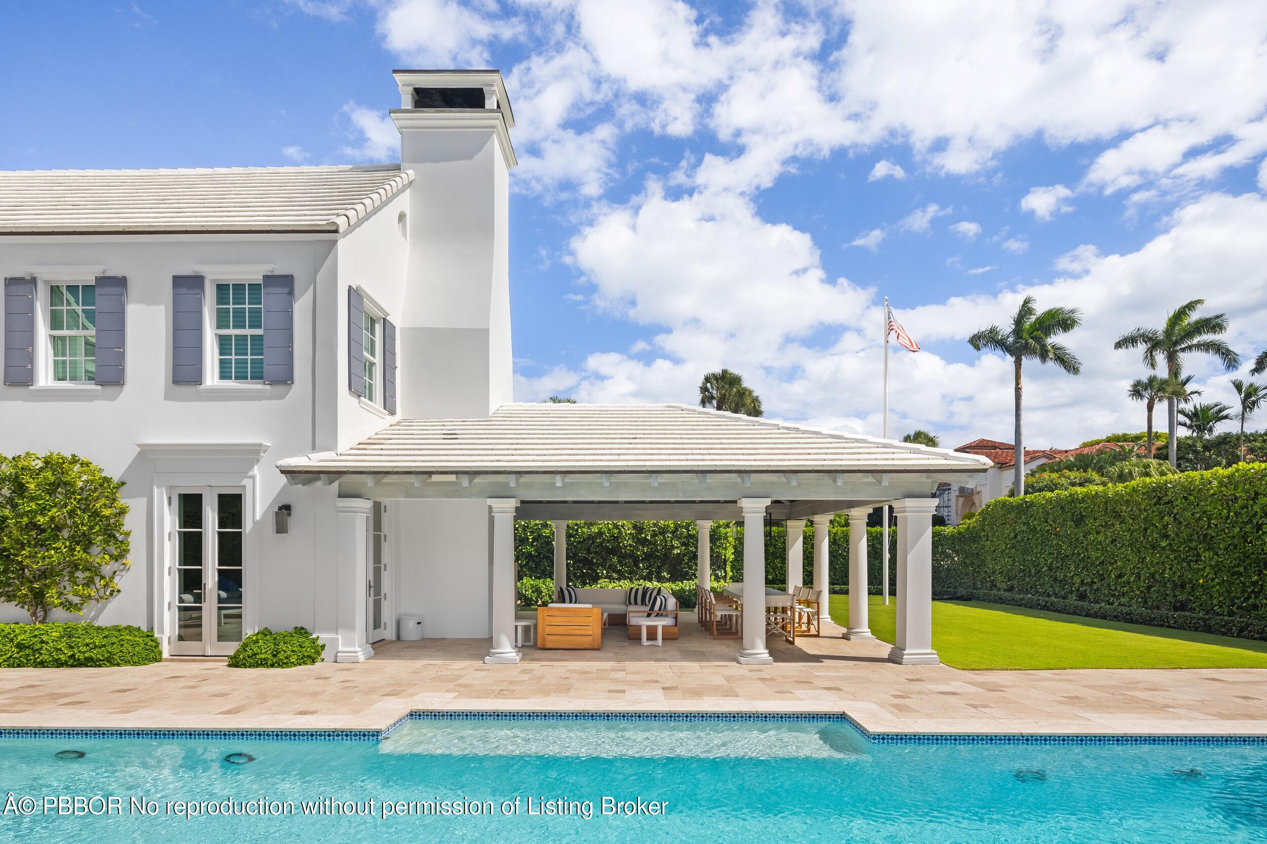 201 Banyan Road Palm Beach, FL 33480 - Photo 35 of 42 a view of a house with swimming pool and porch with furniture