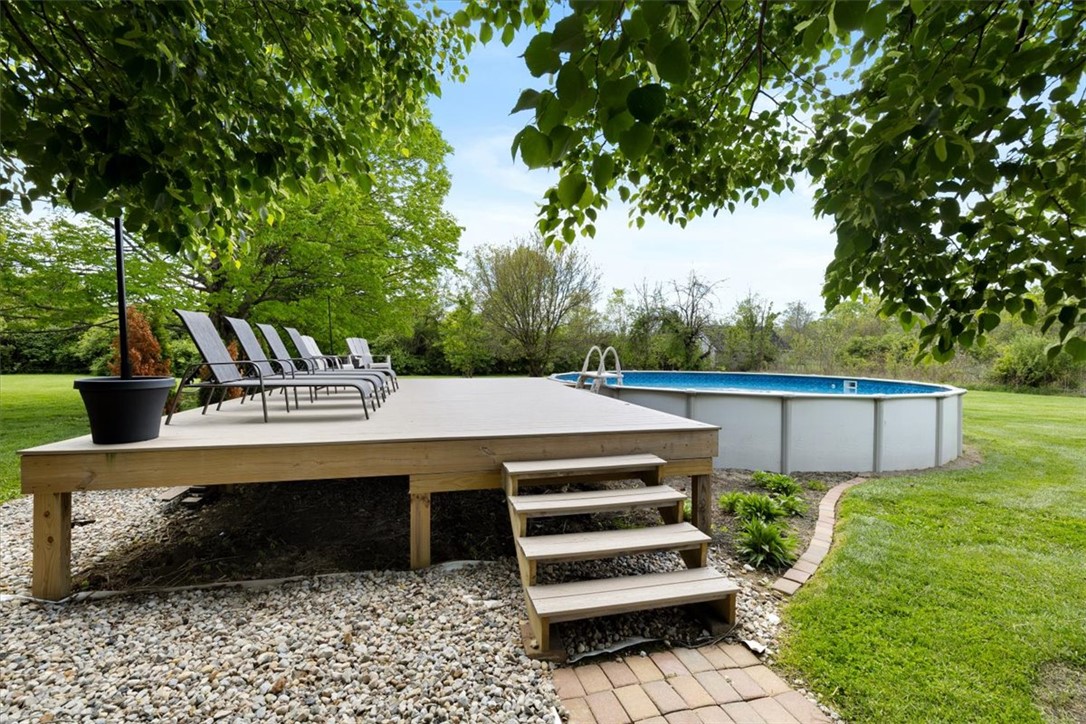 5120 Wheelock Road Troy, OH 45373 - Photo 42 of 67 This spacious yard features a refreshing pool and an expansive deck for outdoor enjoyment.