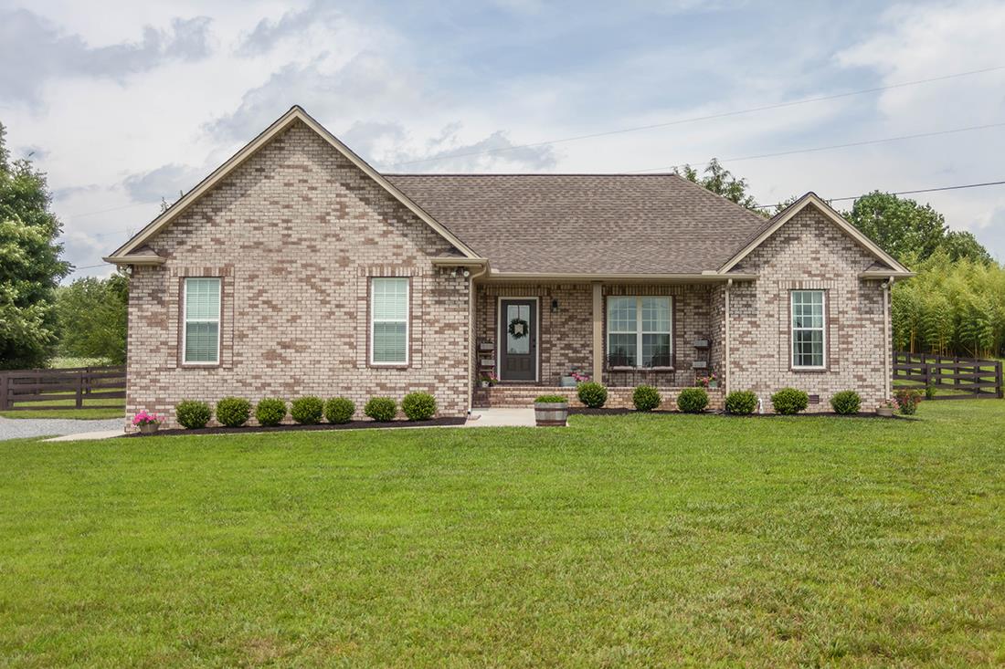 4623 Washington Road Greenbrier, TN 37073 - Photo 1 of 23 a view of a house with a yard and sitting area