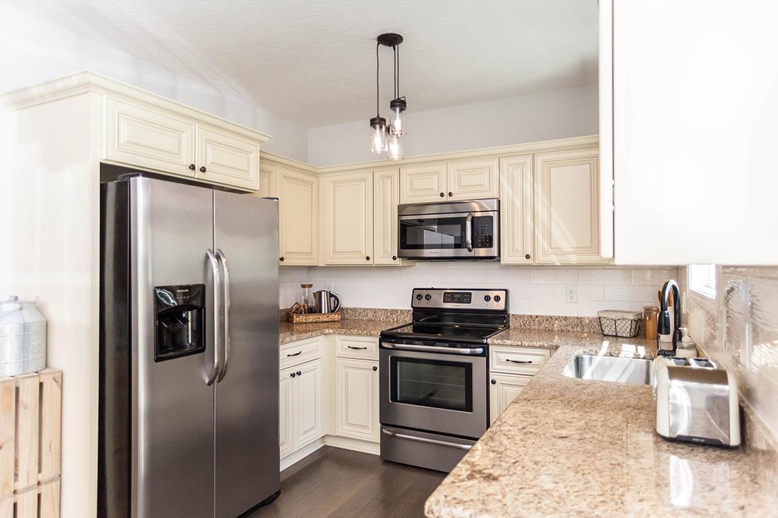 4623 Washington Road Greenbrier, TN 37073 - Photo 6 of 23 a kitchen with a refrigerator stove and microwave