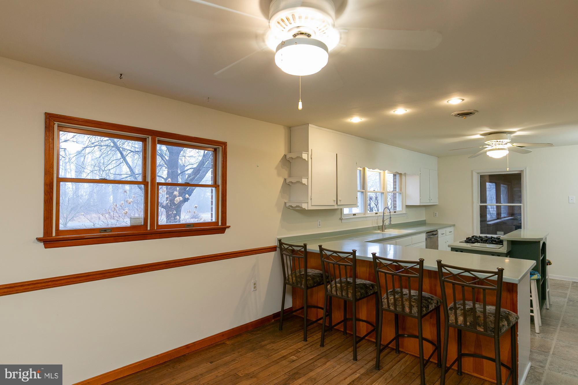 35 Grant Road Kearneysville, WV 25430 - Photo 107 of 122 a view of a dining room with furniture and wooden floor