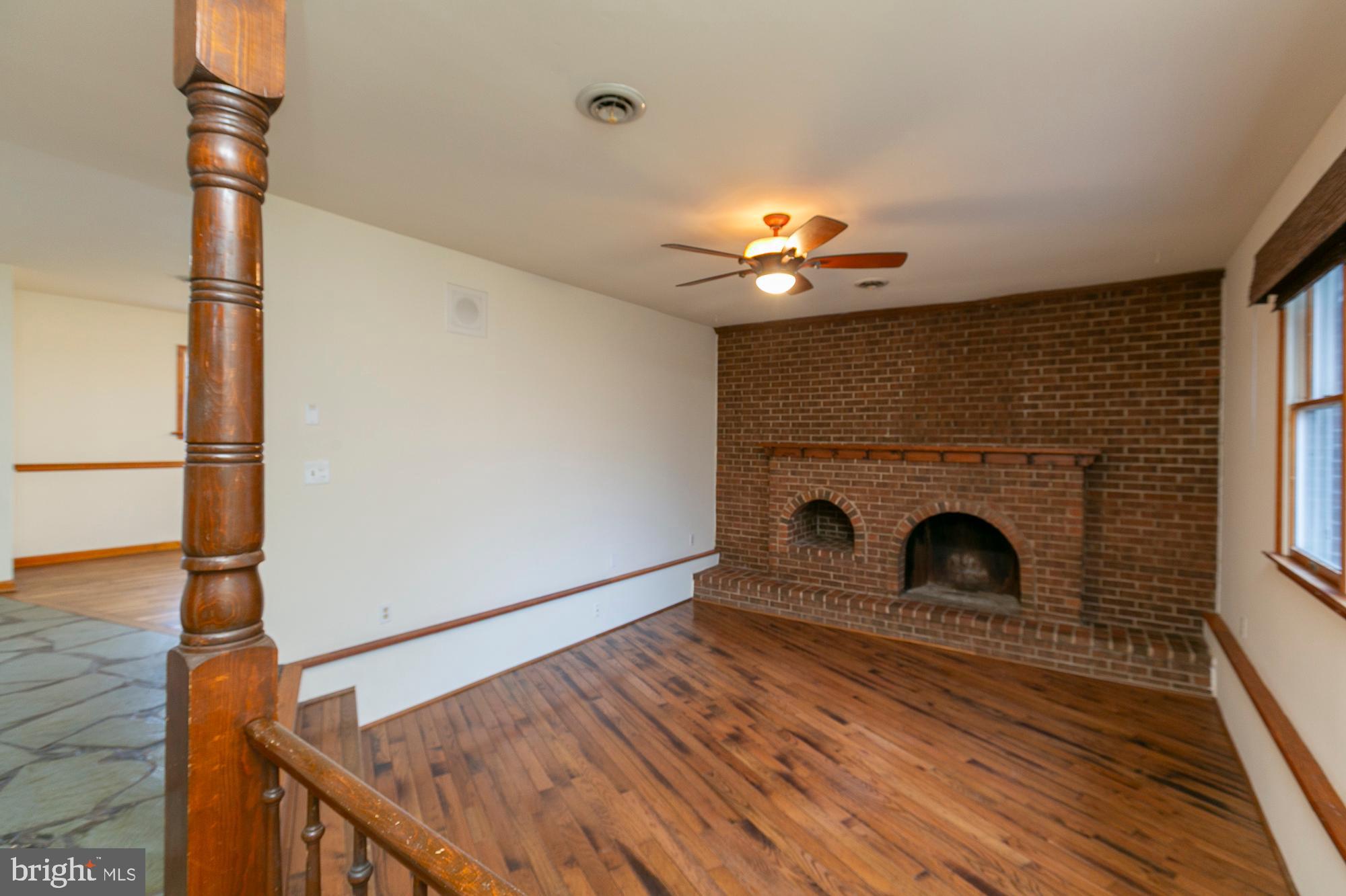 35 Grant Road Kearneysville, WV 25430 - Photo 12 of 122 a view of a livingroom with a fireplace